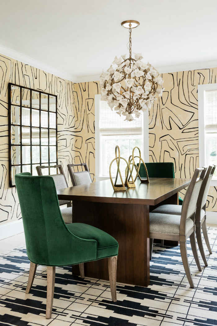 Dining Room With Emerald Chairs And Geometric Area Rug