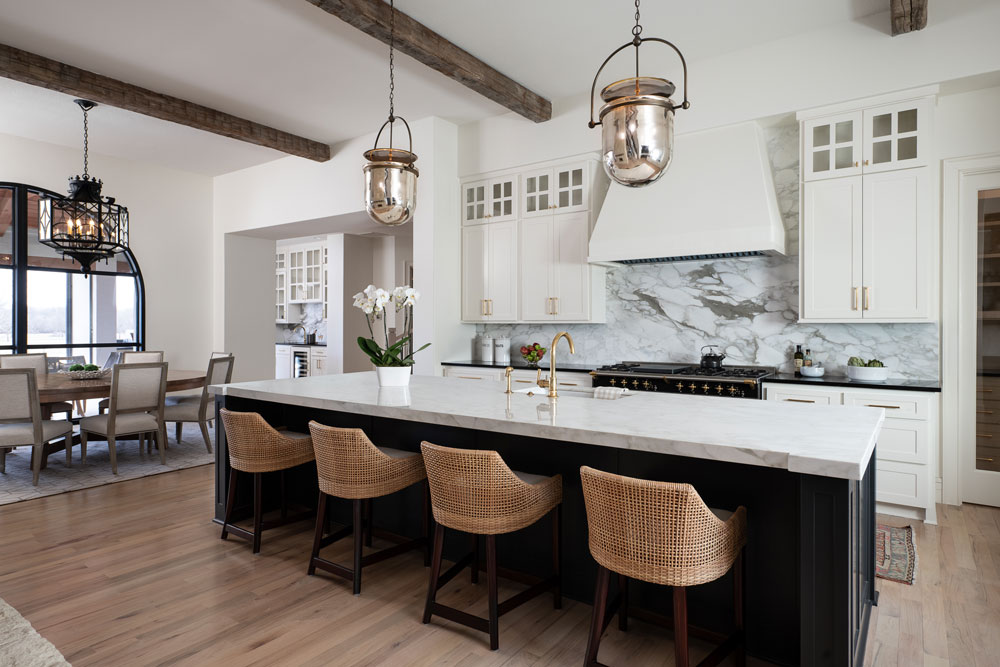 Located in Dallas, Texas. This image features a large and open kitchen with a grand island. O'Hara Interiors designed this Dallas design!