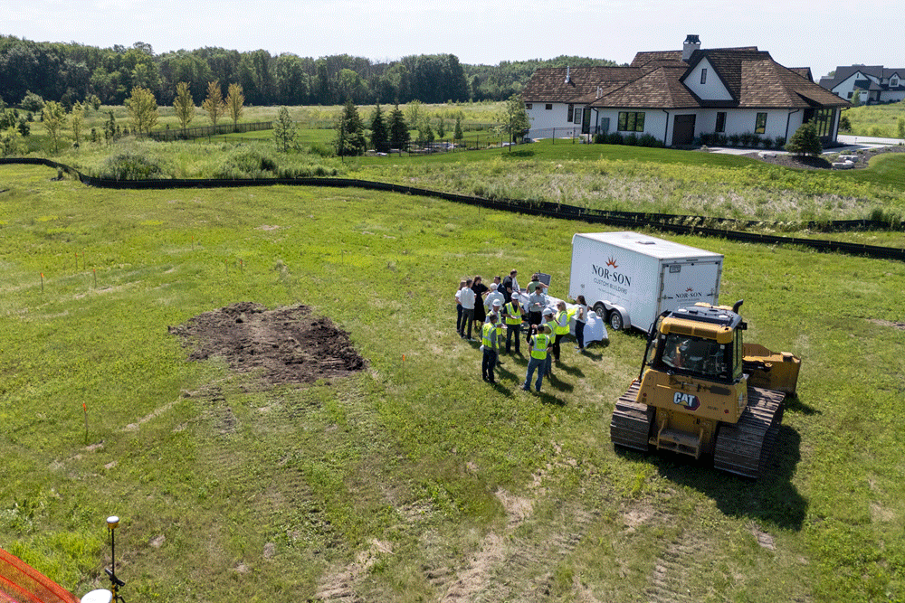 GIF revolving 3 images at the Deer Hill lot in Orono, Minnesota. The images are featuring group of people planning for the custom home.
